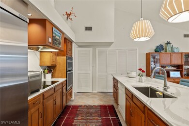 Kitchen with a sink, visible vents, appliances wit