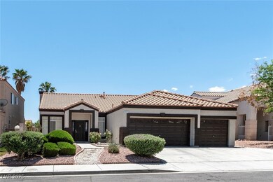 View of front of house with a garage, stucco sidin