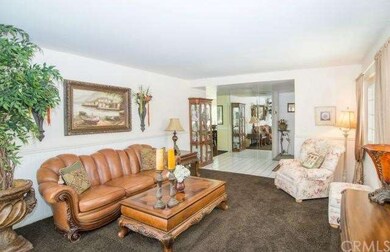 The mirrored wall and tile floors gracing the entry make this home light and bright.
