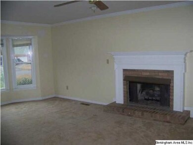 Living Room with fireplace and Bay Window.