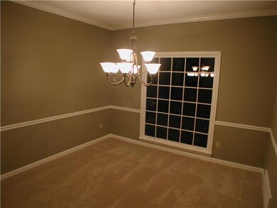 Formal Dinind Room With New Carpet, Fresh Paint, a