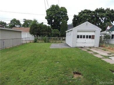 Yard. The back yard and garage area.
