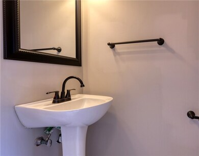This half bath is conveniently located in the entr