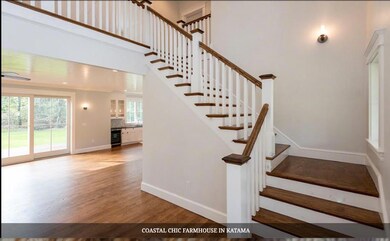 Photo of a similar home showing entry stairway