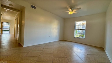 Empty room featuring plenty of natural light, ceil