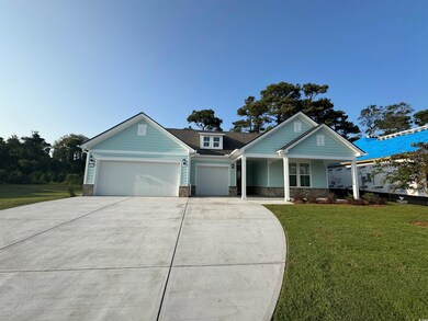 View of front of property with a garage, a porch, 