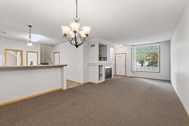 View from dining room to kitchen and living room