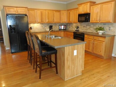 The well-equipped Kitchen features Corian counters