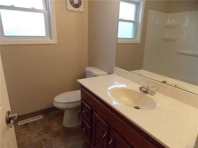 Bathroom has new tub surround, toilet, floor & fre