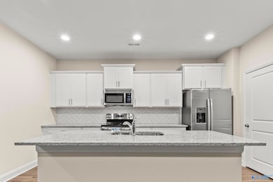 Kitchen with stainless appliances and granite countertops