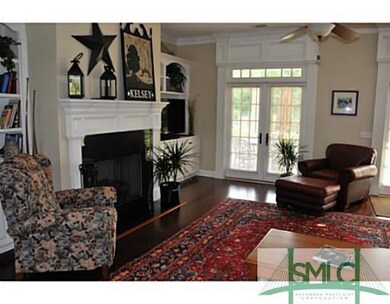Living Room. Beautiful hardwood flooring and an ab