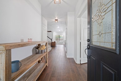 This gorgeous home has an inviting entrance that w