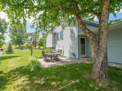 View of concrete patio at the side of the home.