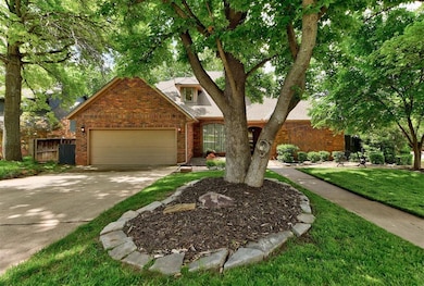 View of front of house with brick siding, concrete