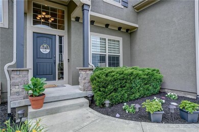 Nicely landscaped and covered entrance.