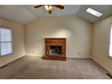 Family Room with Fireplace, Ceiling Fan and Skylig