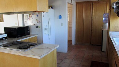 Kitchen and Pass Through to Living Room