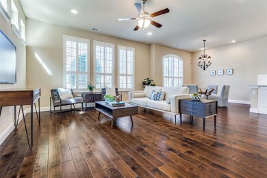 Living room featuring baseboards, visible vents, d