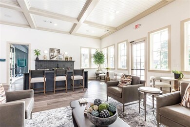Living room featuring beamed ceiling, wood-type fl