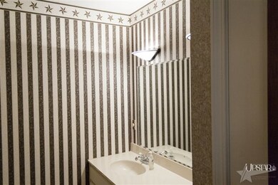 Even the spacious second bathroom includes a doubl