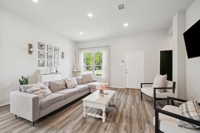 Bright and inviting living room featuring high cei