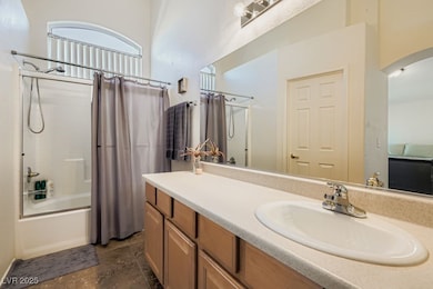 Bathroom featuring shower / bath combination with curtain and vanity