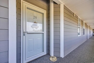 Doorway to property with covered porch