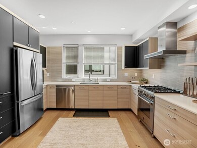 Spacious, modern kitchen is gorgeous & bright.