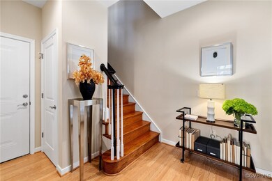 Staircase with hardwood / wood-style flooring