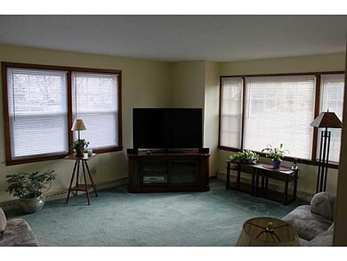 Living Room Lots of natural light coming through t