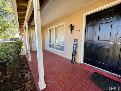 View of exterior entry with covered porch