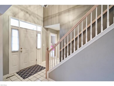 Foyer with tile floors