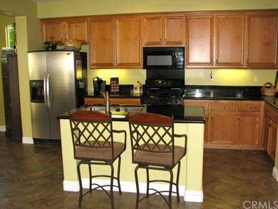 Open Kitchen with Granite Counter tops and center 