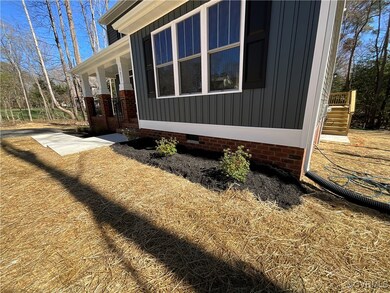 View of side of home with crawl space, board and b