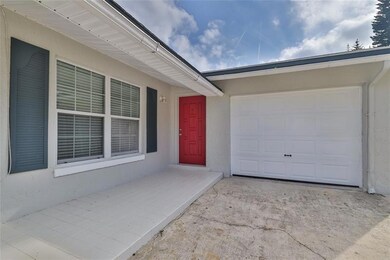 Front Exterior Featuring Eye-Catching Red Door