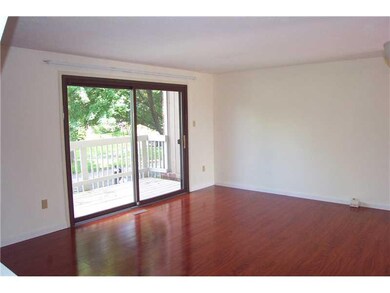 Living Room. New laminate wood flooring.  Sliding 