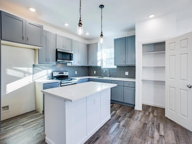 Kitchen with appliances with stainless steel finis