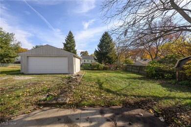 View of yard with a garage and patio