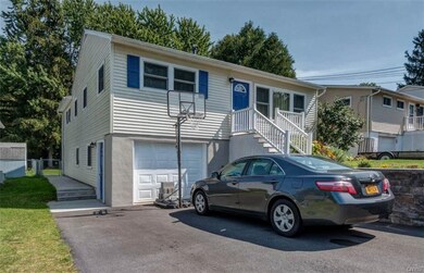 Doublewide driveway has plenty of room for four ca