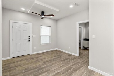 Foyer featuring ceiling fan, light wood-type flooring, baseboards, and recessed lighting