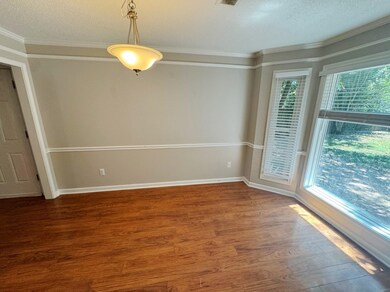 Unfurnished room featuring a textured ceiling, orn
