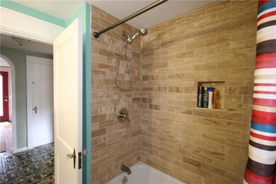 Beautiful tile work in first floor bath