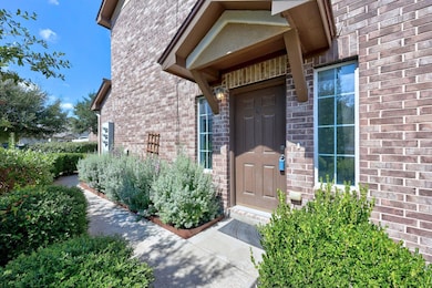 Doorway to property with brick siding