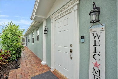 Entrance to property with stucco siding