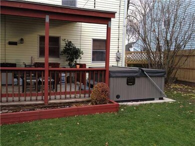 Exterior Back Large covered deck with hot tub (hot