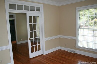 Through the french doors of the living room is the