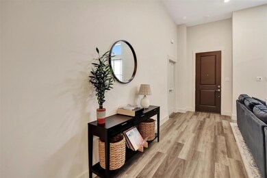Hallway featuring light hardwood / wood-style floo