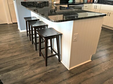OVERSIZED GRANITE ISLAND WITH OUTLET