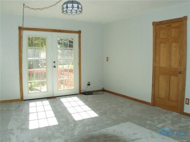 Living room with french doors to deck.
