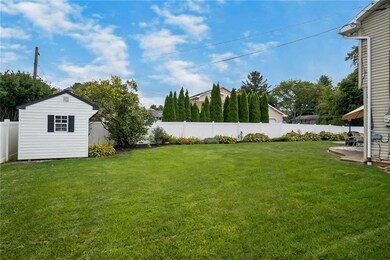 Fenced in spacious backyard with shed